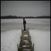 At the end of a long pier on a frozen lake...