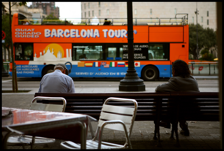 two men on a bench in barcelona