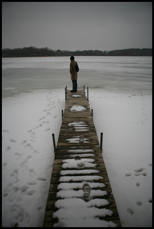 At the end of a long pier on a frozen lake...
